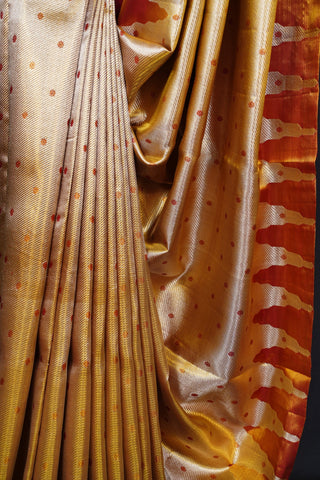 Elegant Gold Tissue Kanjivaram Saree with Red Butta Weaving Elegant Gold Tissue Kanjivaram Saree with Red Butta Weaving