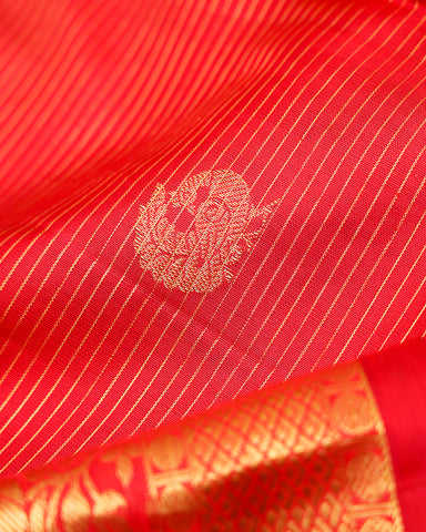 The red Kanjivaram silk saree