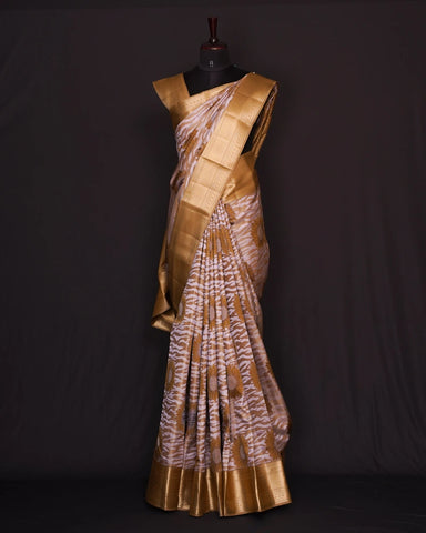 The cream and white  kanjivaram silk saree